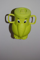A green, cartoon-style All Grow’d Up Cup shaped like an elephant, with two handles and big eyes, viewed from above against a plain white background.
