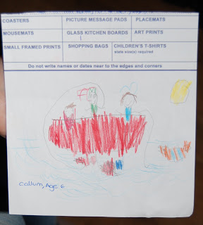 A child's drawing shows two people in a red boat on blue water, with a yellow sun in the sky. Created for a school fundraising project with Funmats, the picture is drawn on paper featuring printed order form categories. Text reads “Callum, Age 6.”.