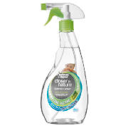 A clear spray bottle with a green sprayer, perfect for dispensing your favourite cleaning spray.