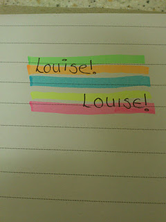A sheet of lined paper with “Louise!” written twice. Each word is highlighted using vibrant Stabilo writing products: green, blue, and yellow stripes on top, and pink and green below.