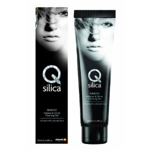 A black tube and its box labelled “Qsilica REMOVE Makeup & Grime Cleansing Gel” show a greyscale woman’s face, hair partly veiling one eye. This standout make-up remover pairs bold black packaging with sleek white text—a true competition for others.