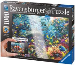A Ravensburger 1,000-piece jigsaw puzzle box featuring a vibrant underwater scene with colourful fish and coral. The box displays a hand holding a mobile phone, showcasing augmented reality video-animation features.