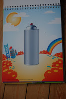 A drawing of a large silver spray paint tin in the centre, with a sun, rainbow, red flowers, and a small rocket on a colourful landscape background—perfect for any Artzooka fan or robot enthusiast.