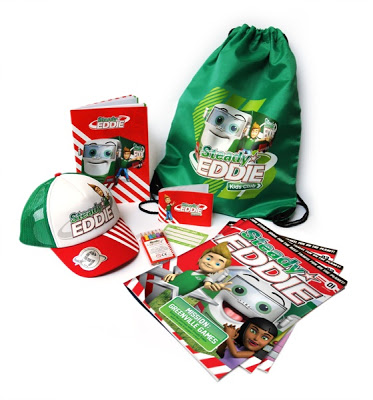 A green drawstring bag, cap, notebooks, activity book, and name tag—all featuring the "Sergeant Eddie" cartoon character and Steady Eddie World branding—are neatly arranged on a white background.