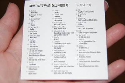 A hand holds a "Now That's What I Call Music! 78" tracklist, dated 11th April 2011—perfect inspiration for your next Music Trivia or Quiz Game, with a numbered list of song titles and artists in black text on white card.