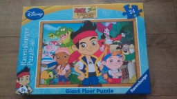 A Ravensburger Giant Floor Puzzle box featuring characters from "Jake and the Never Land Pirates," with Jake and his friends standing in a colourful, tropical background.