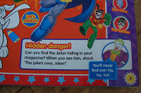 A colourful DC Super Friends Magazine page features superheroes and a boxed challenge asking readers to find the Joker, with an image of the Joker and a speech bubble saying, "You'll never find me! Ha, ha, ha!.