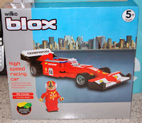 A Wilko Blox toy set box featuring a red high-speed racing car and a driver figurine on the front. Perfect for ages 5 and up, this makes an exciting addition to wilko gifts, with a city skyline background and product details on the left side.