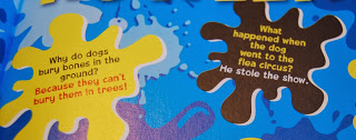 A close-up of a colourful page from a Beano Annual with two jokes in paint splat shapes—an ideal Gift Idea for 2014: "Why do dogs bury bones in the ground? Because they can't bury them in trees!" and "He stole the show at the flea circus!.