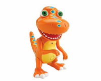 A toy figure of an orange dinosaur from Dinosaur Train with blue diamond-shaped spots, big green eyes, a wide smiling mouth, and yellow accents on its belly and tail, perfect for Christmas gifting, stands against a white background.