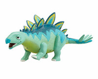 A toy stegosaurus dinosaur inspired by Dinosaur Train, with a blue and green body, yellow and blue plates, and a spiked tail, stands on four legs against a white background—perfect for a Christmas present.