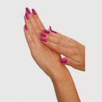 Two hands with long, bright pink manicured nails are held together against a plain white background, reminiscent of Elle Macpherson’s iconic "The Body" elegance.