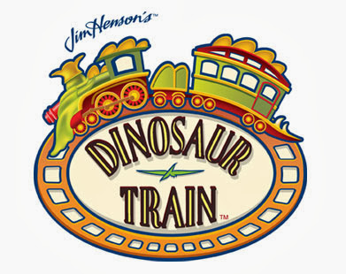 Festive logo for Jim Henson’s “Dinosaur Train,” featuring a train with dinosaur features above an oval sign with the title in bold letters, surrounded by an orange railway track border and subtle Christmas accents.