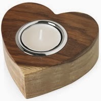 A small white tealight candle sits in a metal holder set into a heart-shaped wooden base with a natural wood finish, making it a charming choice for Wilko Valentine's Day Gifts.