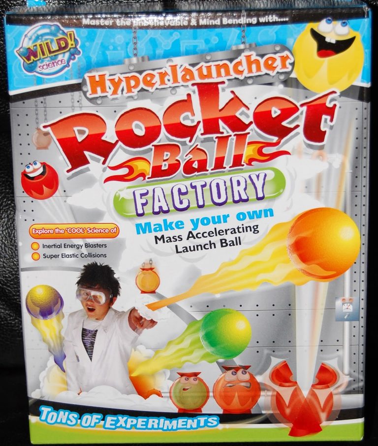 Colourful toy box for "Hyperlauncher Rocket Ball Factory" shows a child in goggles launching balls. The packaging features vibrant rocket balls, energetic cartoon faces, and invites kids to review their own mass-accelerating launch ball creations.