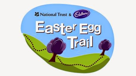 Logo for the National Trust & Cadbury Easter Egg Trail, featuring a green hilly landscape with two purple trees and a dotted path under a blue sky, capturing the spirit of Easter fun.