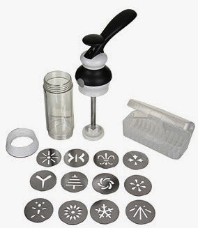 A set of baking tools featuring an OXO Good Grips biscuit press with a handle, transparent container, white ring, plastic storage box, and 12 round metal discs with various cut-out designs.
