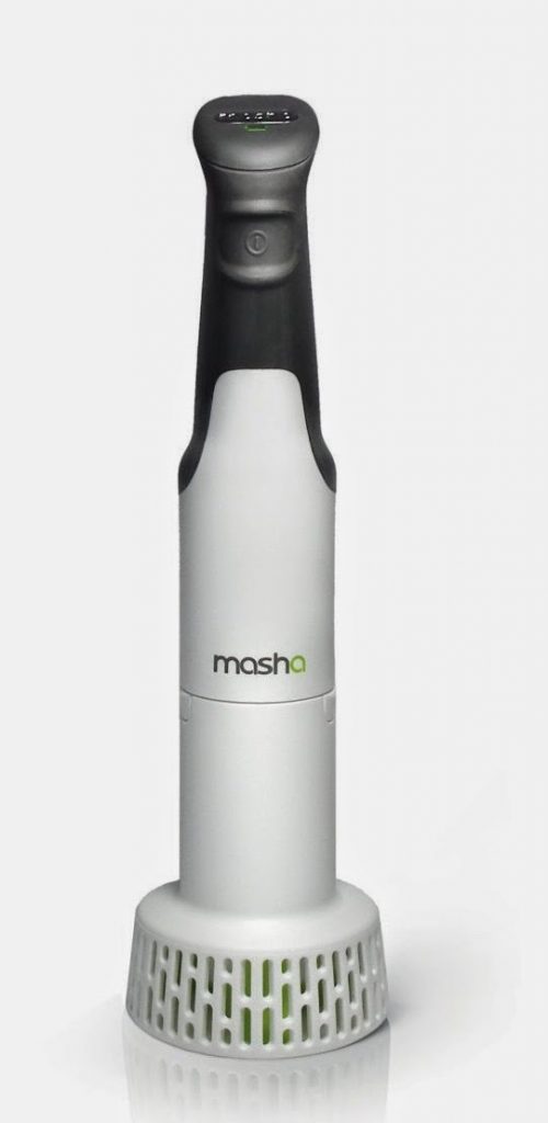 A handheld electric potato masher with a grey handle, white body, and vented base, labelled "masha" on the front, delivers the Perfect Mash every time, standing upright on a white background.