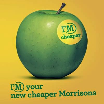 A green apple with a yellow "I'M cheaper" sticker rests on a yellow background, capturing the Morrisons spirit. Below, vibrant green and yellow text reads "I'M your new cheaper Morrisons," perfect for your weekend shop.