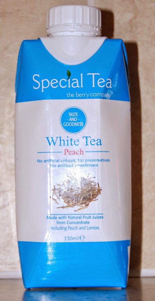 A blue and white carton of "Special Tea" white tea with peach flavour, featured in Degustabox, contains natural fruit juices with no artificial colours, preservatives, or sweeteners, and holds 330ml—a refreshing pick from your favourite snack subscription.