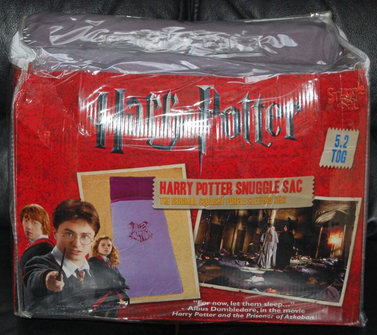 A packaged Harry Potter Snuggle Sac features Harry Potter branding, a picture of Harry pointing his wand, and an image of the purple sleeping bag with film scenes. Review notes it’s from "Harry Potter and the Prisoner of Azkaban.