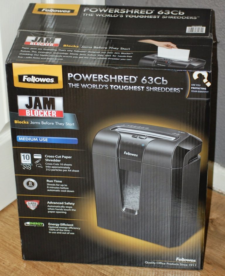 A Fellowes shredder box featuring the Powershred 63Cb, with images and details like "Jam Blocker," cross-cut shredder technology, energy efficiency, and an 8-minute run time.
