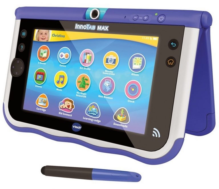 A blue and white VTech InnoTab MAX tablet with a stylus is displayed. The screen shows colourful app icons for games, music, books, and learning—perfect for young writers eager to enter a writing competition. A child's profile name "Christina" appears in the top left corner.
