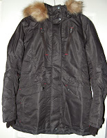 A dark-coloured winter coat from the Aldi Specialbuys Outdoor Range, featuring a fur-lined hood, displayed against a light background.