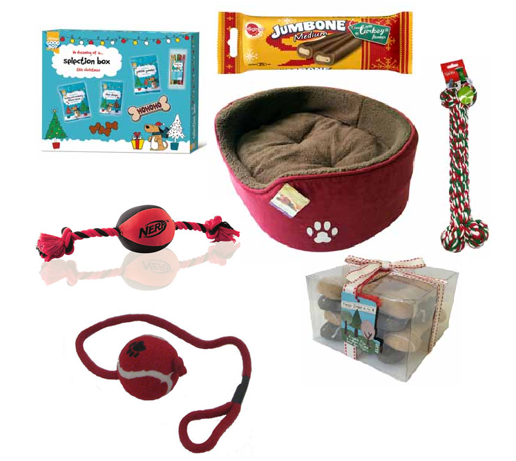 A collection of Santa Paws dog gifts including a treat box, chew bone, red pet bed, rope toys, and a packet of dog biscuits, all arranged on a white background.