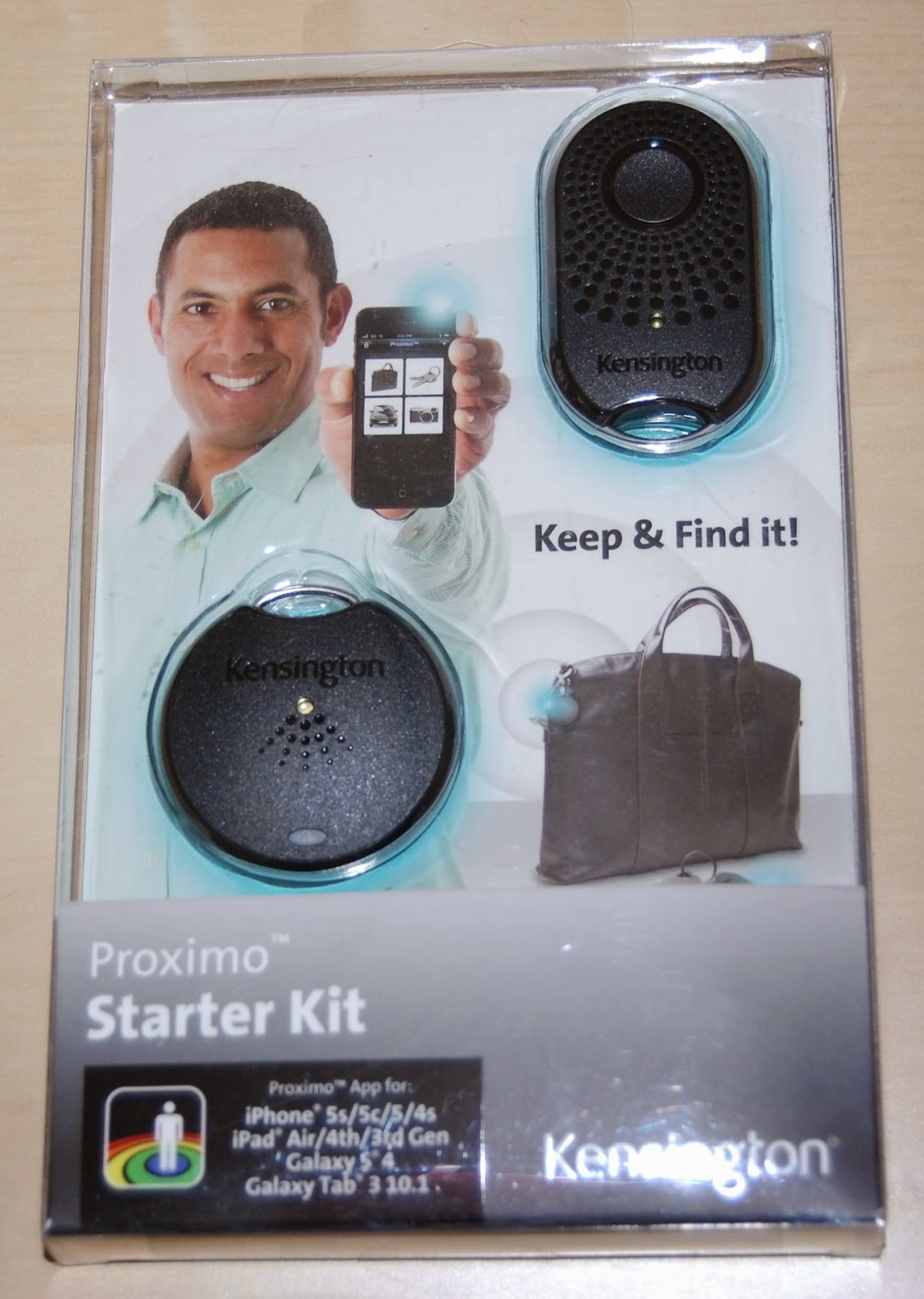 A retail package for the Kensington Proximo Starter Kit shows two tracking devices, a smiling man holding a phone, and a bag. Perfect for technology enthusiasts, it says "Keep & Find it!" and lists compatible iPhone and Galaxy devices.