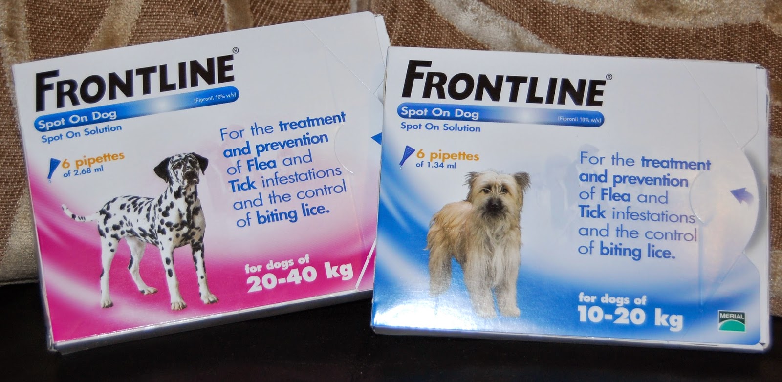 Two boxes of Frontline Spot On Solution for dogs, providing effective pet protection against fleas and ticks—one for 20-40 kg dogs with a Dalmatian, and one for 10-20 kg dogs with a shaggy dog.