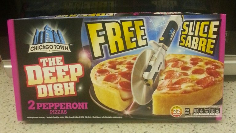 A Chicago Town Deep Dish 2 Pepperoni Pizzas box displays a Slice Sabre promotion—a pizza cutter shaped like a lightsabre—beside images of two pepperoni pizzas on the packaging.