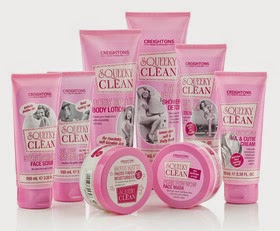 A collection of pink Squeaky Clean skincare products, including face scrub, body lotion, shower gel, face mask, and body butter, arranged together on a white background—perfect Valentine’s Day gift ideas for pampering someone special.