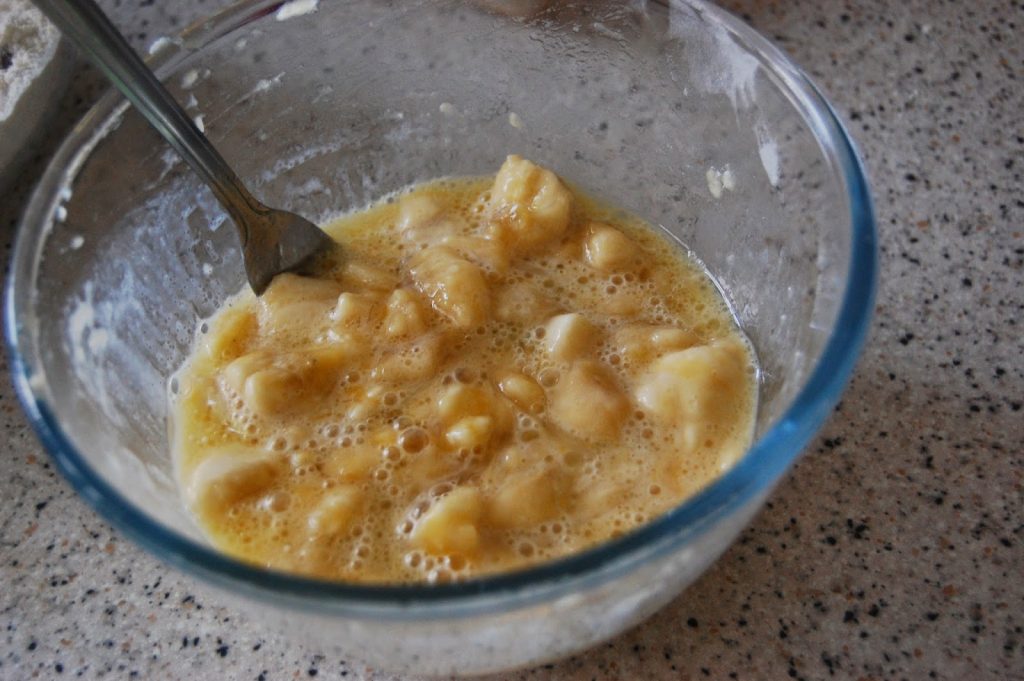 A bowl of food with a spoon, perfect alongside homemade Chocolate Chip Muffins for a cosy breakfast.