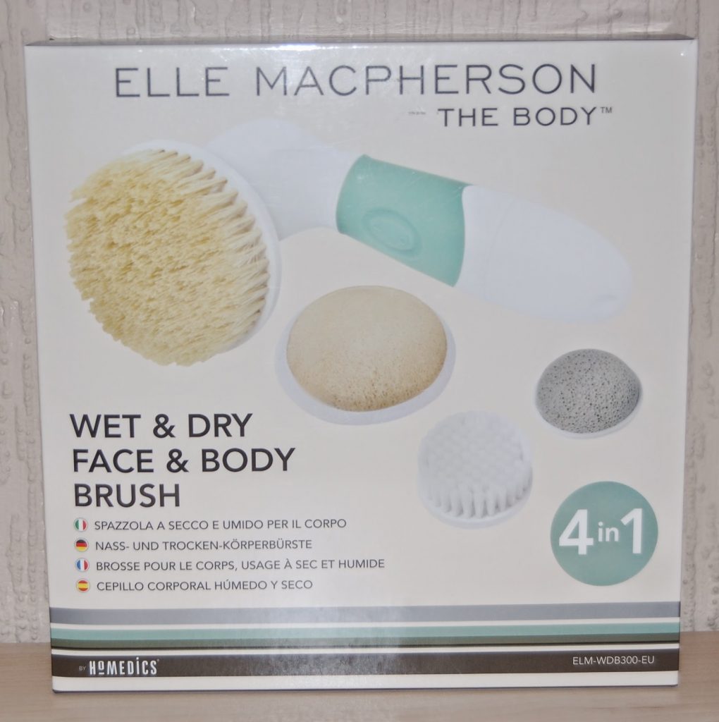 Box for the "Elle Macpherson The Body" 4-in-1 wet and dry face and body brush, featuring the main device, three brush heads, product name, and multilingual descriptions—a perfect choice for beauty gifts or Mother’s Day presents.