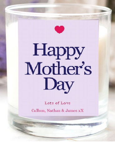 A glass candle with a label reading "Happy Mother’s Day" in large letters, a small red heart above, and "Lots of Love Callum, Nathan & James xX" in smaller text below—perfect for any Pamper Hamper or thoughtful present.