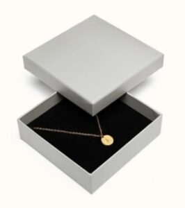 a beautiful necklace with an A initial on a flat gold disk