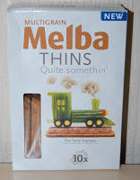 A box of Multigrain Melba Thins featuring a veggie train on the front—perfect for your next snack subscription box. The packaging says “Quite somethin’” and “The Tasty Engineer.” A fun find for any Degustabox review!.