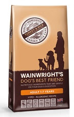 A bag of Wainwright's Dog's Best Friend adult dog food, turkey and rice flavour with advanced nutrition, for dogs aged 1–7 years. The packaging features a silhouette of a person with two dogs and product details in brown tones.