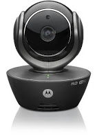 A black HD video camera with a round lens on a swivel base, featuring a Motorola logo and a small green indicator light—perfect for pet owners seeking gift ideas for pets to keep an eye on their furry friends from anywhere.
