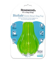 A green Rosewood BioSafe Germ Smart Dog Toy in packaging, featuring product benefits and a blue heart graphic—an excellent choice for Gift Ideas For Pets. The packaging says, "Rosewood It's a dog thing! BioSafe Germ Smart Dog Toy.