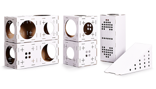 Six white cardboard play structures for cats, featuring cubes with circular and paw-shaped cut-outs, a tall rectangular box with holes, and a sloped ramp with dots on the side—perfect pet gifts or creative gift ideas for pets.