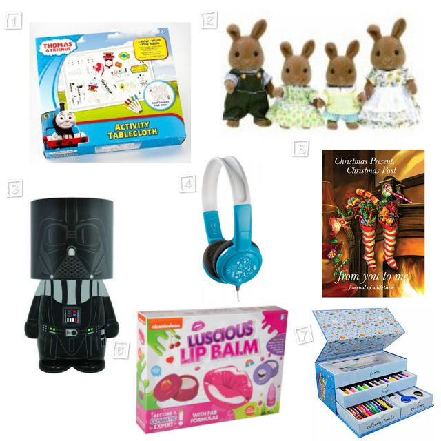 A collage of Christmas gift ideas for children, featuring a Thomas & Friends activity tablecloth, four rabbit family figurines, a Darth Vader money box, blue headphones, a Christmas book, luscious lip balm kit, and a colourful piano keyboard set.