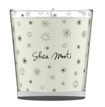A white candle in a clear glass jar decorated with small, black snowflake patterns. The words "Shea Mooi" are written in black script on the front, inspired by the natural essence of shea mooti.