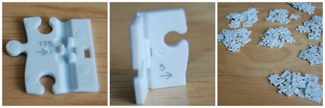 Three images: a close-up of a white Ravensburger 3D puzzle piece labelled "175" with arrows and notches, a side view of a similar piece labelled "5," and a pile of many white puzzle pieces on a wooden surface.