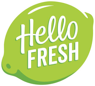 The image shows the HelloFresh logo with the words "Hello Fresh" in white, playful script on a bright green, stylised lime background—just as you’d spot in a glowing HelloFresh review.