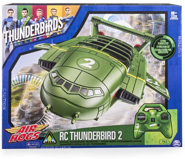 Air Hogs Thunderbird 2 RC toy in its packaging, featuring a green remote control aircraft and controller. The box is branded with Thunderbirds Are Go and recommended for ages 8 and over. Remote control fans will love this Thunderbird 2!.