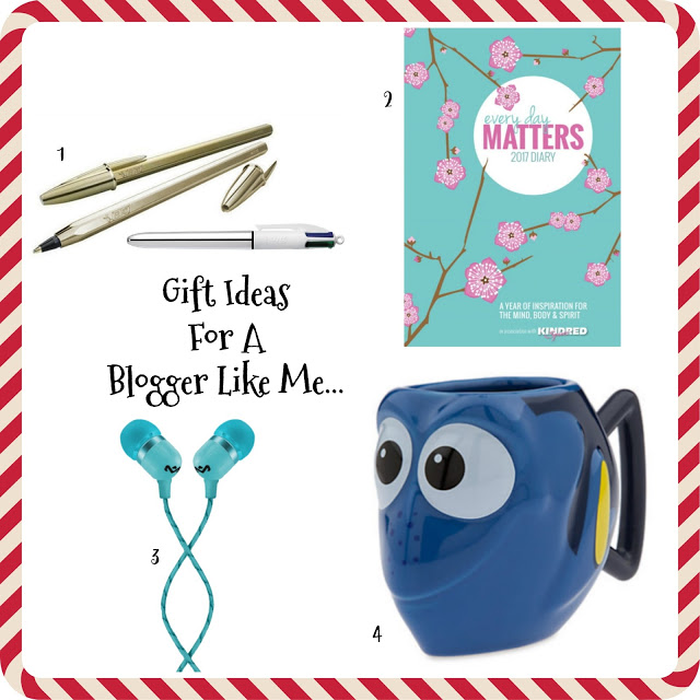 A collage titled "Gift Ideas For A Blogger Like Me" showcasing Christmas gift ideas for bloggers: a gold pen set, floral 2017 diary, teal earphones, and a blue Dory mug, all arranged on a white background with a red striped border.