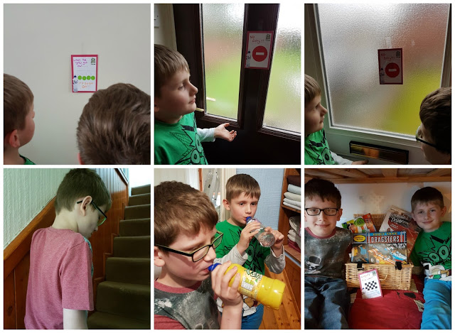 A collage of six photos shows two boys taking part in an Easter Treasure Hunt—reading signs on walls and doors, walking up stairs, drinking juice, and sitting together in front of a basket filled with snacks and board games.