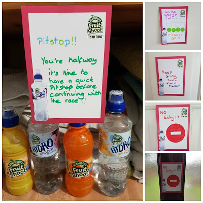 A collage of signs for a children's race and Easter treasure hunt. The main sign says, "Pit stop!! You're halfway, it's time to have a quick pit stop before continuing!" Juice bottles sit below, while other signs share race instructions and rules.